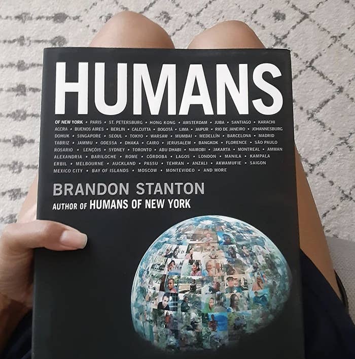 a reviewer holding a copy of the book