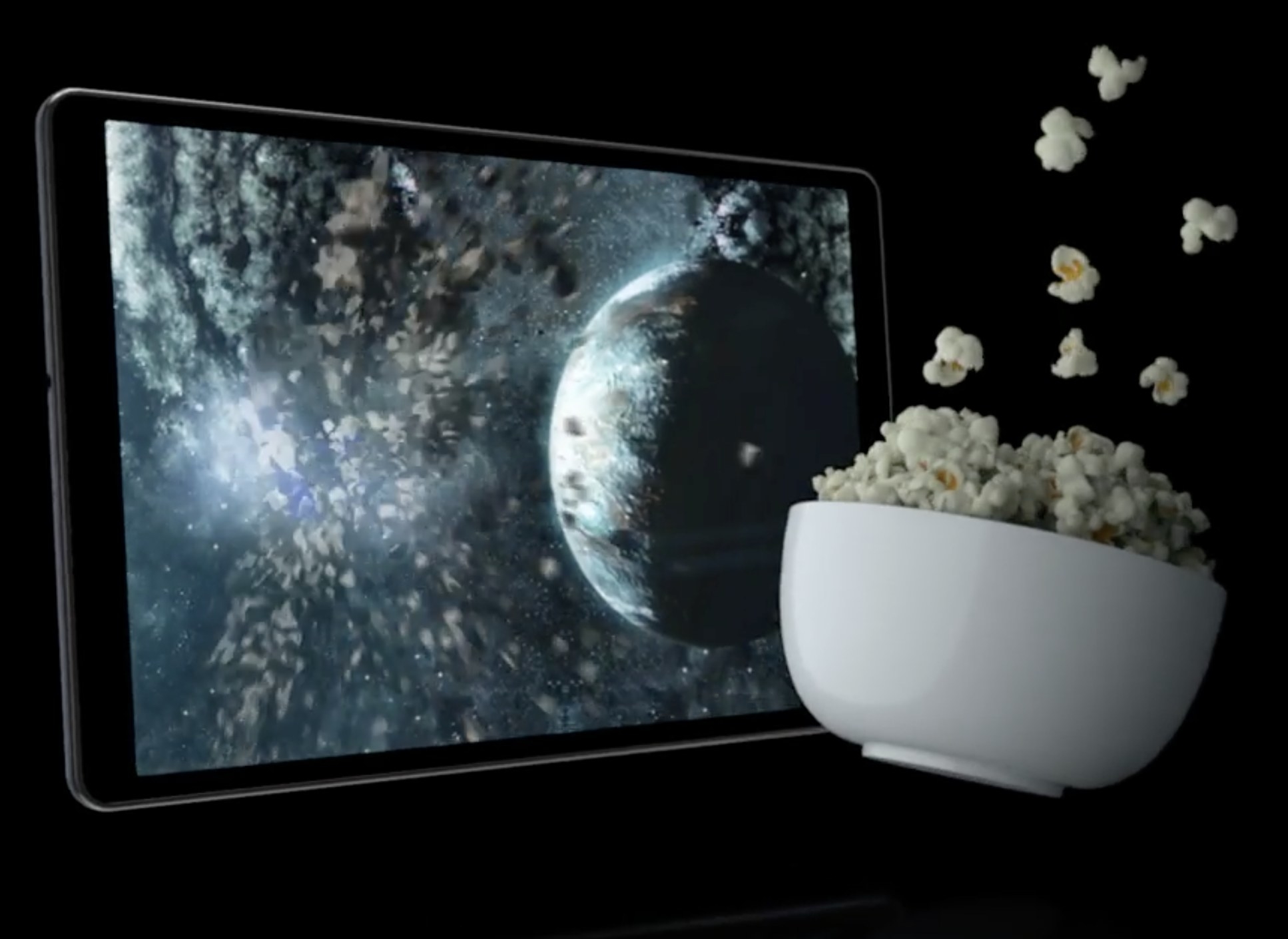 The tablet next to popcorn