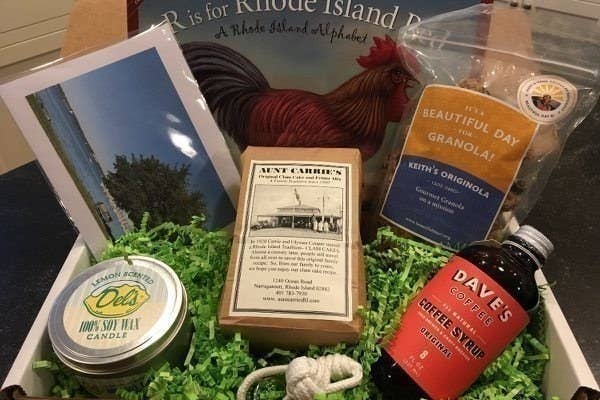An assortment of goods from Rhode Island including granola, a candle, and coffee syrup