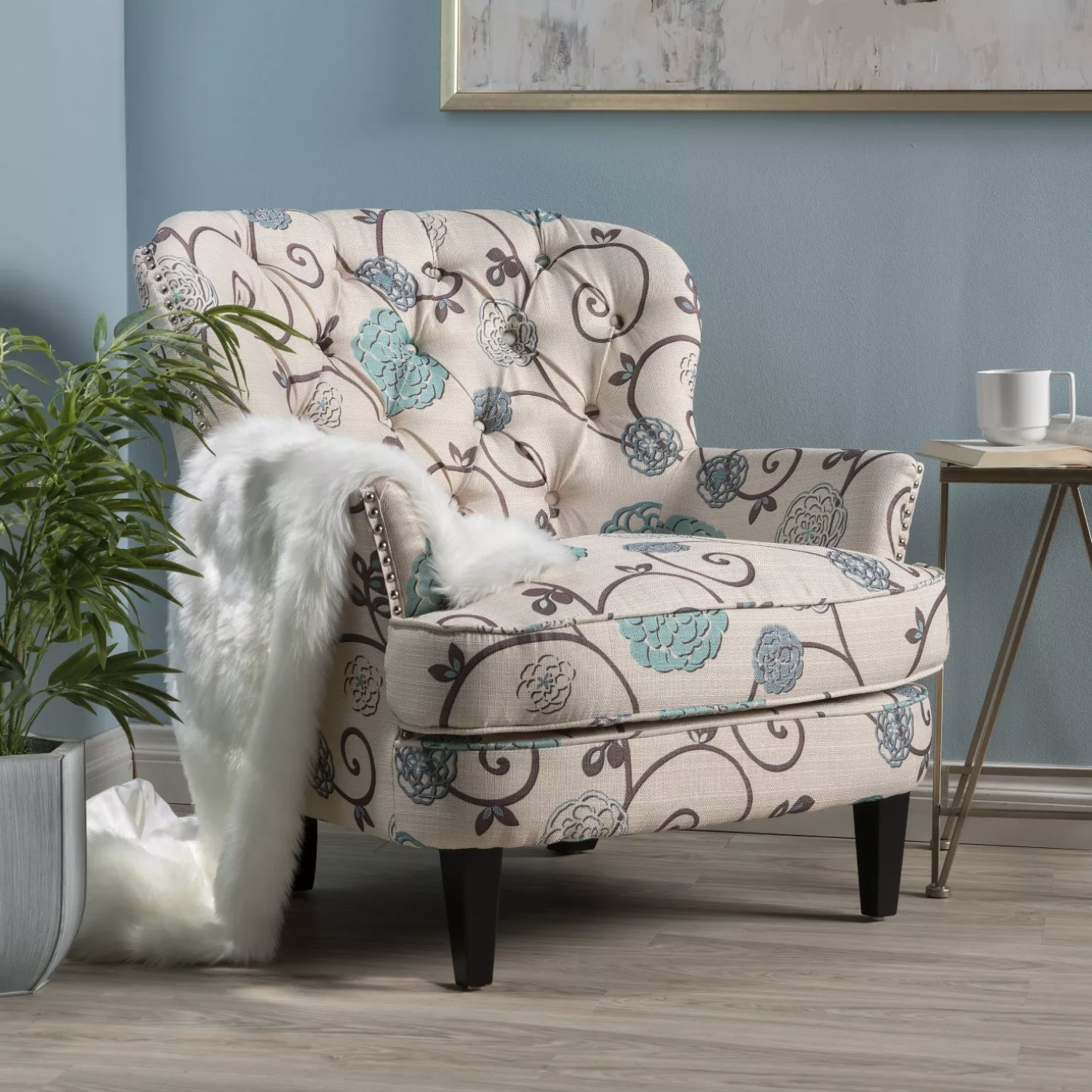 The beige accent chair with a blue floral design