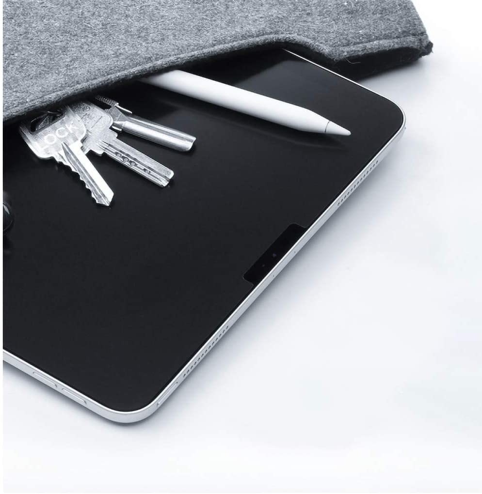 The ipad screen protector showing that it&#x27;s matte with keys and a pencil on top