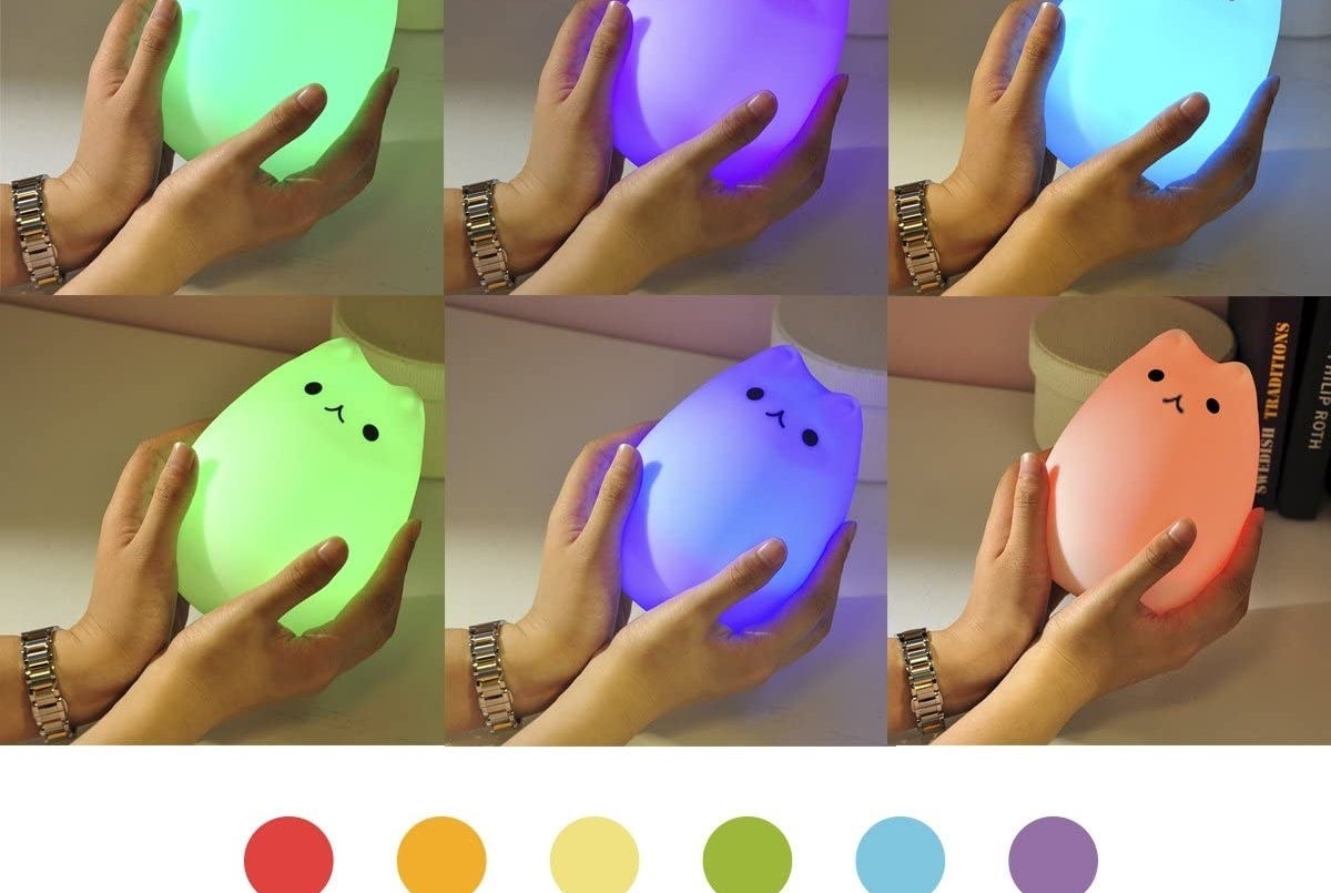 person holding the lamp showing six different colours