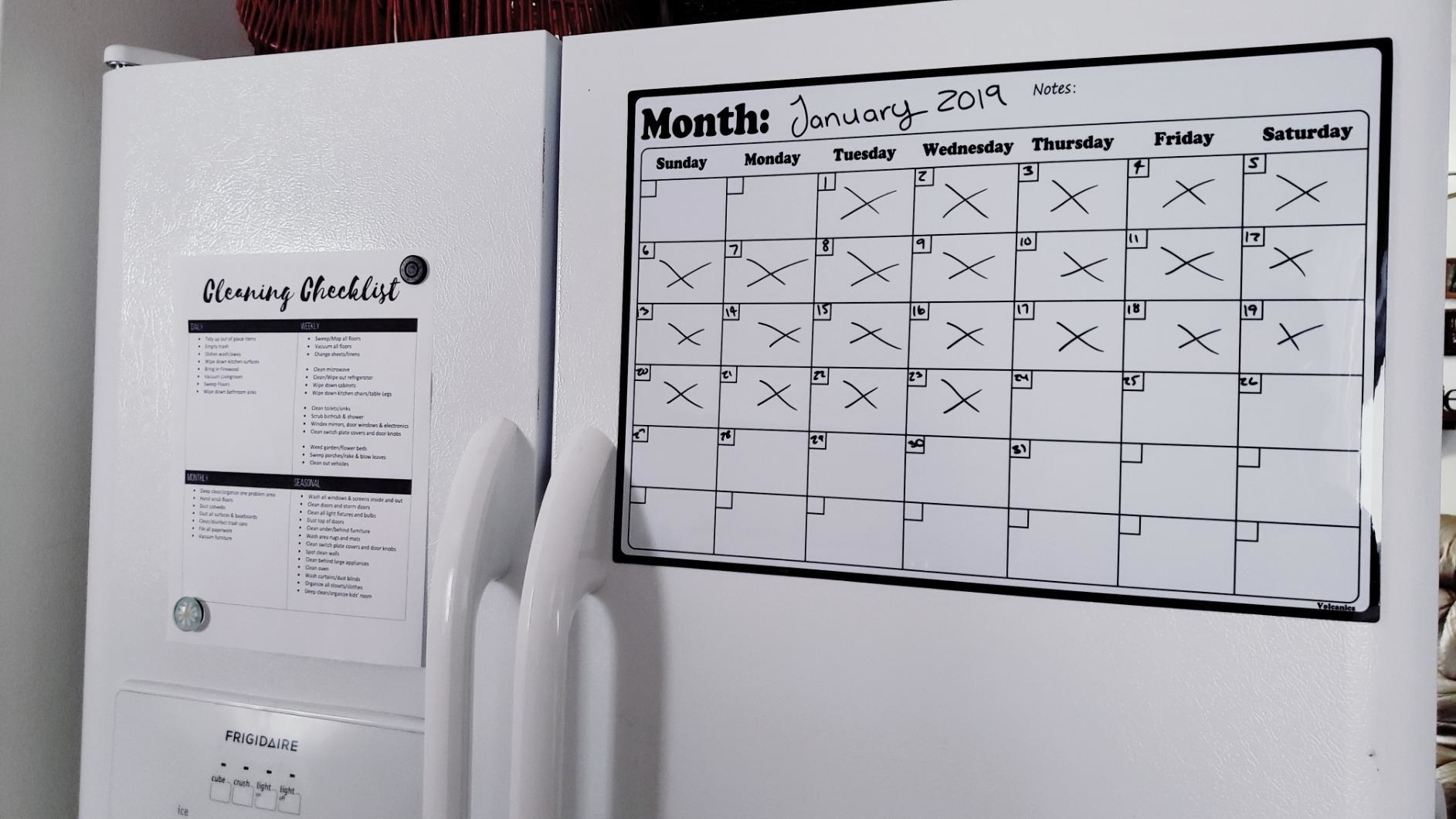 reviewer image of the volcanics fridge calendar on a customer&#x27;s fridge