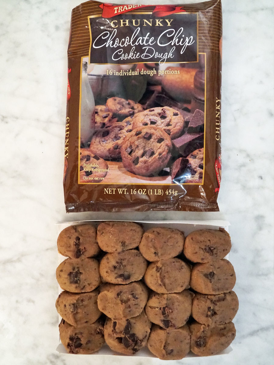 Trader Joe&#x27;s chunky chocolate chip cookie dough balls next to the packaging.