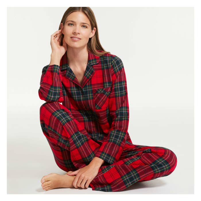A model wearing red and black plaid flannel pyjamas
