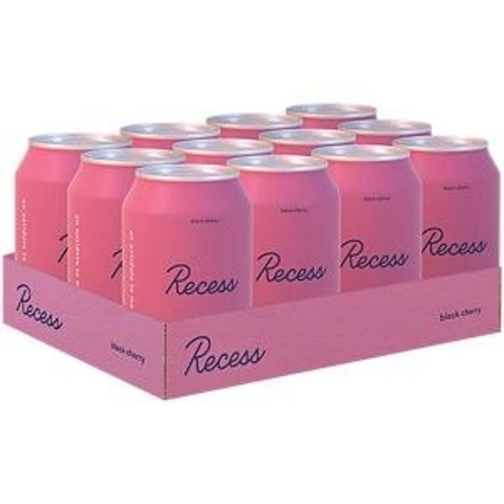 A 12-can case of Recess Sparkling Water Drinks in Black Cherry flavor