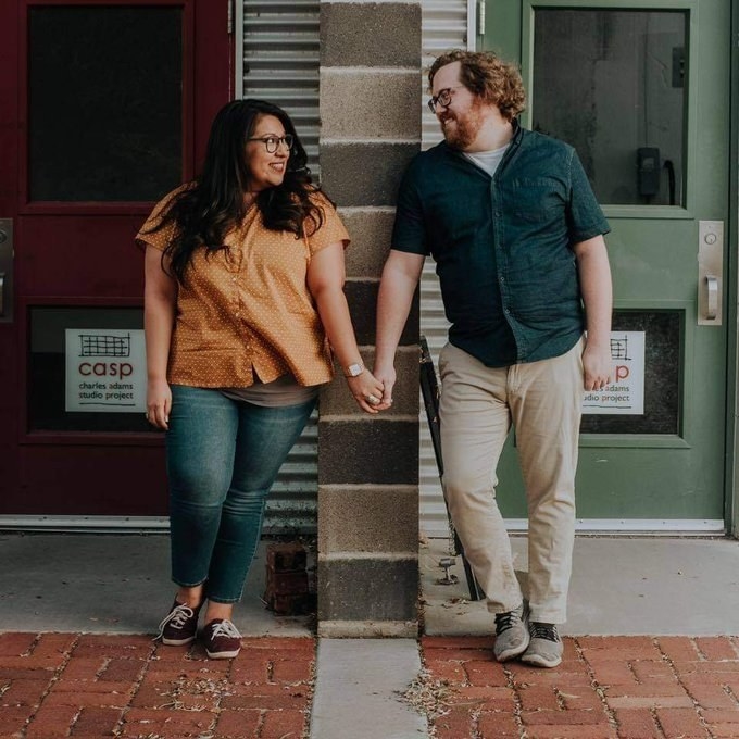 The couple holding hands 