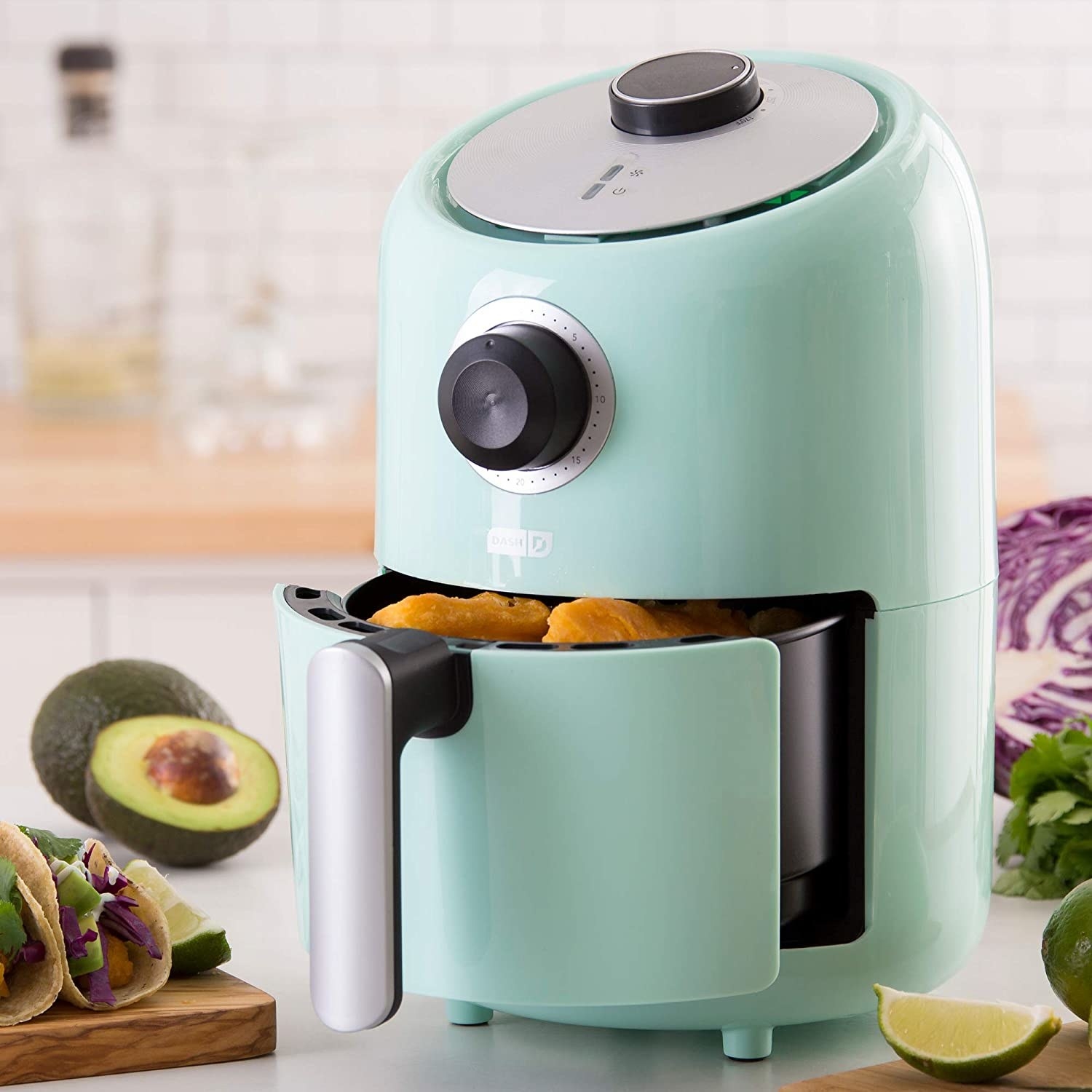 A small air fryer on a kitchen countertop