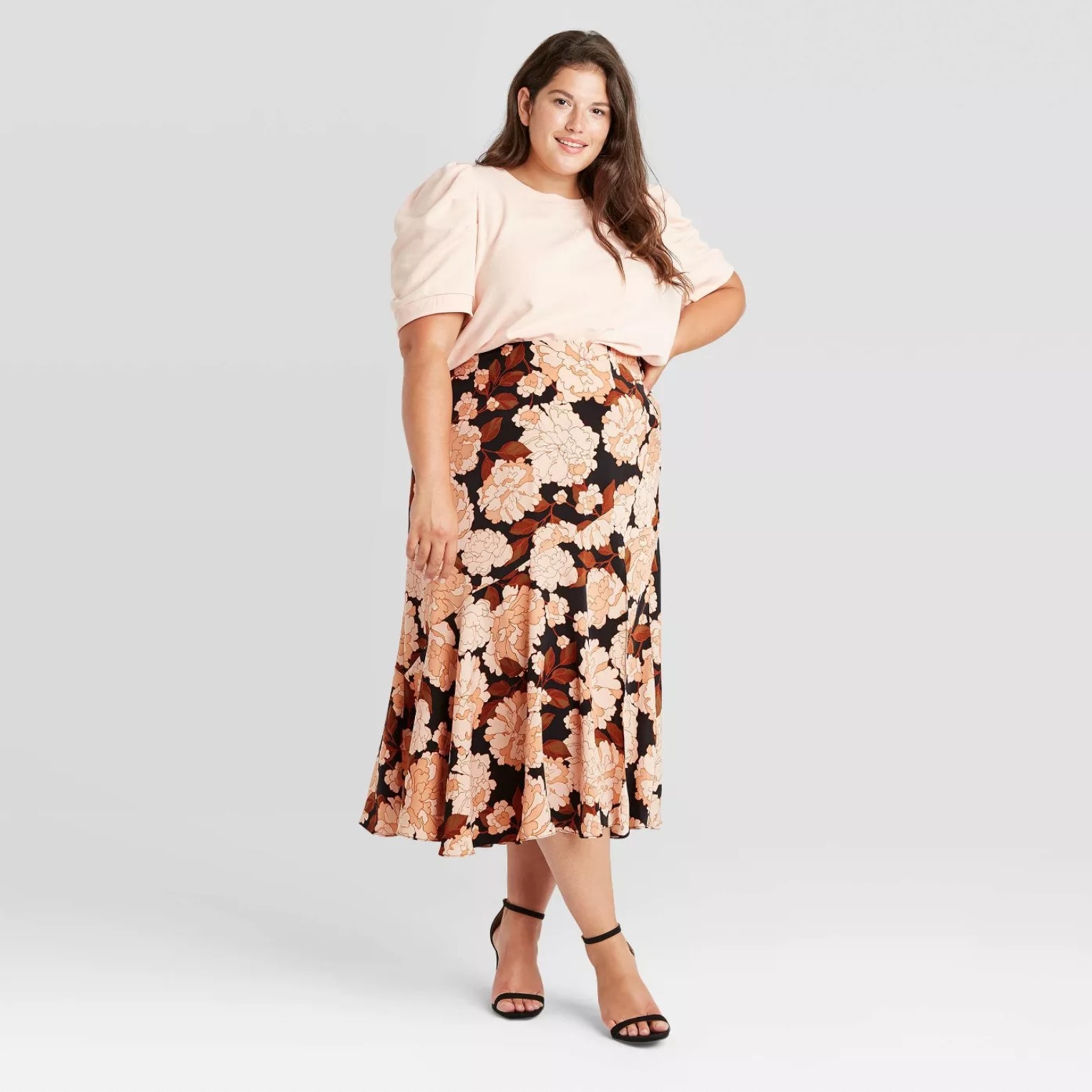 Model wearing the skirt in floral pink