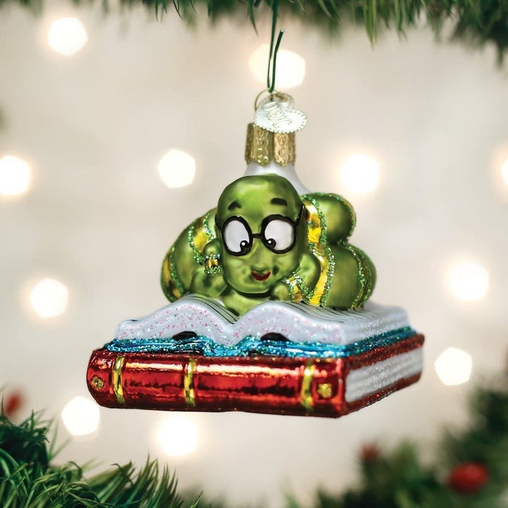 a stack of books ornament with a bookworm