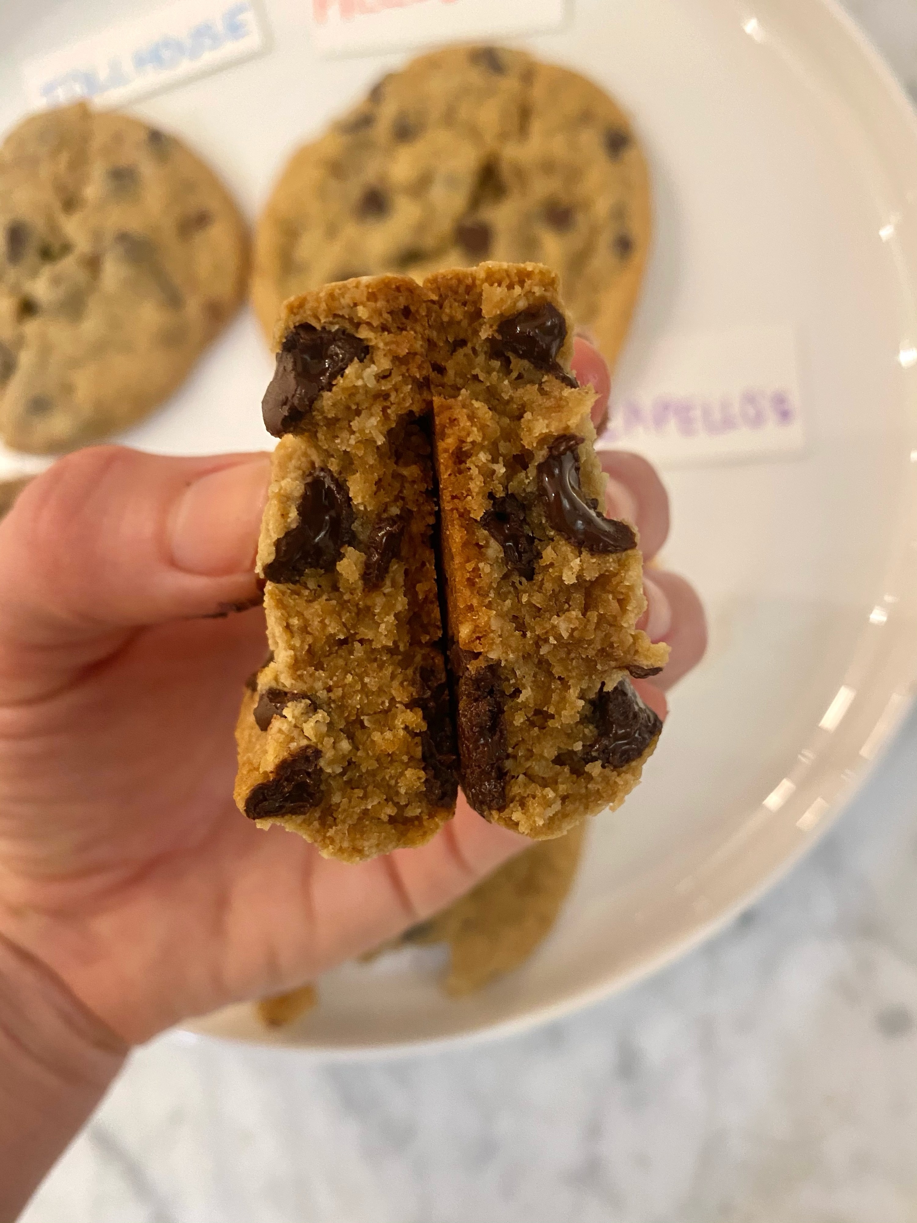 A Cappello&#x27;s chocolate chunk cookie cut in half.