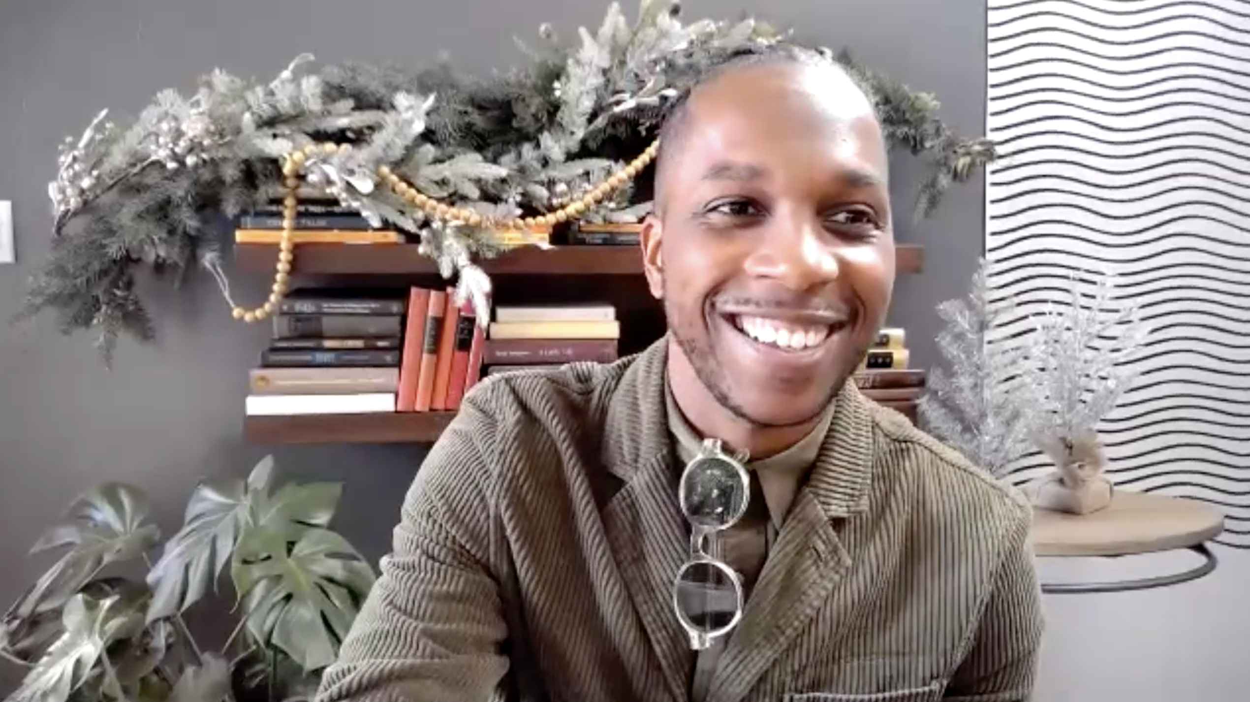 Leslie smiling with Christmas decorations in the background