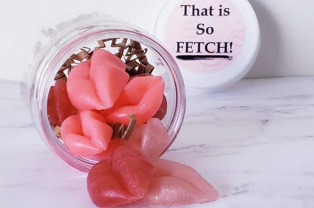 a jar of small lip-shaped soaps with a lid that says