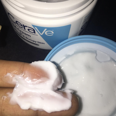 reviewer dipping hands in jar