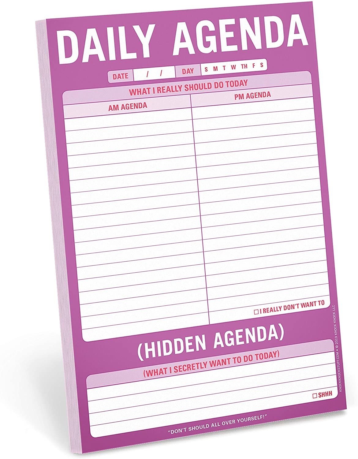 notepad that says &quot;daily agenda&quot; on it