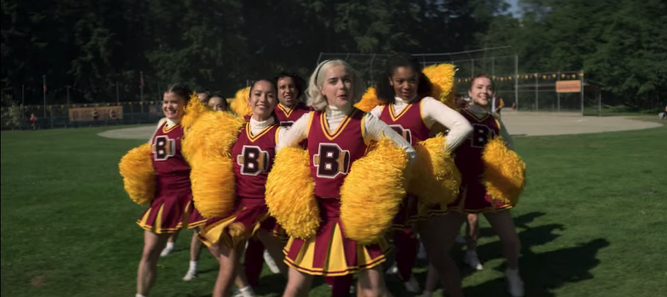 Sabrina, Jaz and other cheerleaders performing a pep rally 