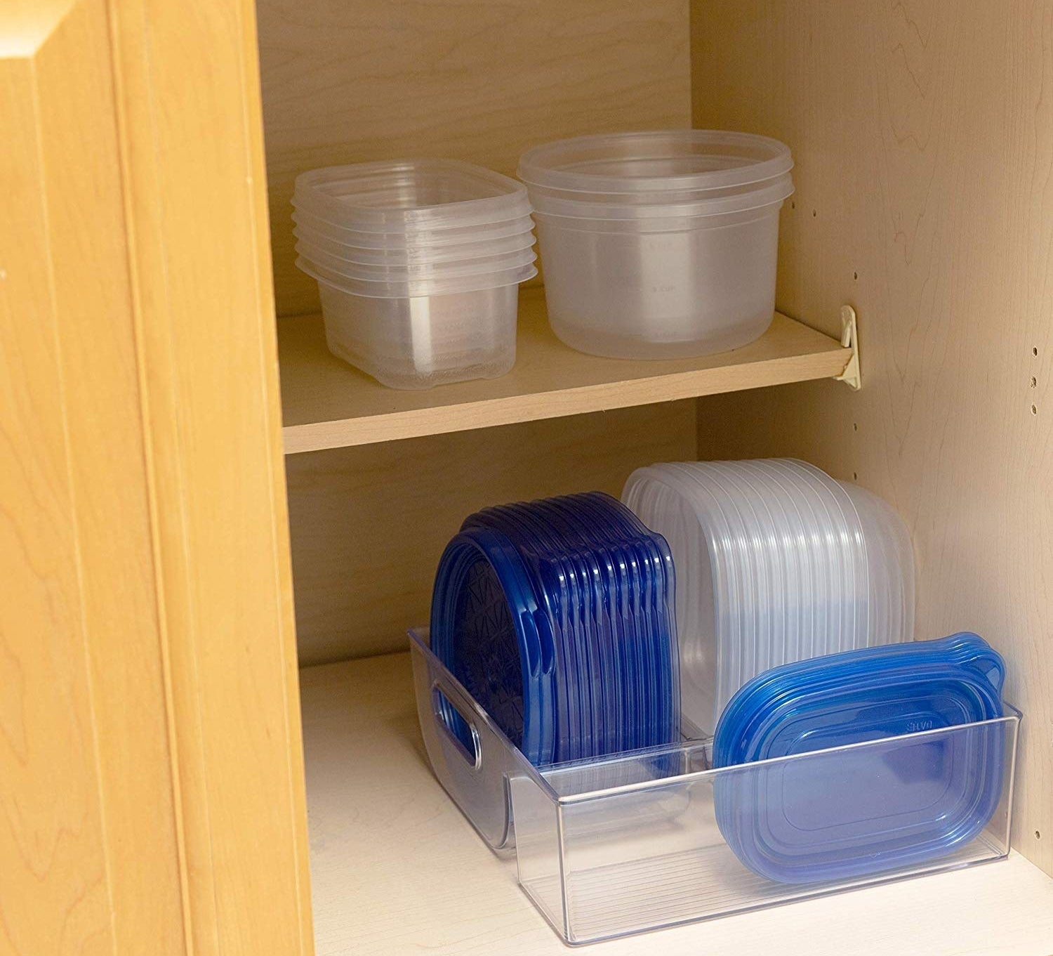 The organizer with lids and tupperwares in compartments