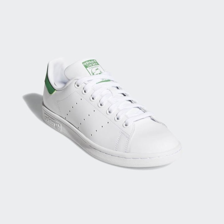Stan Smith sneakers with green backing and tongue detailiing