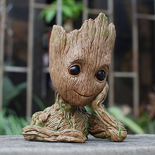 A Groot flower pot on a table