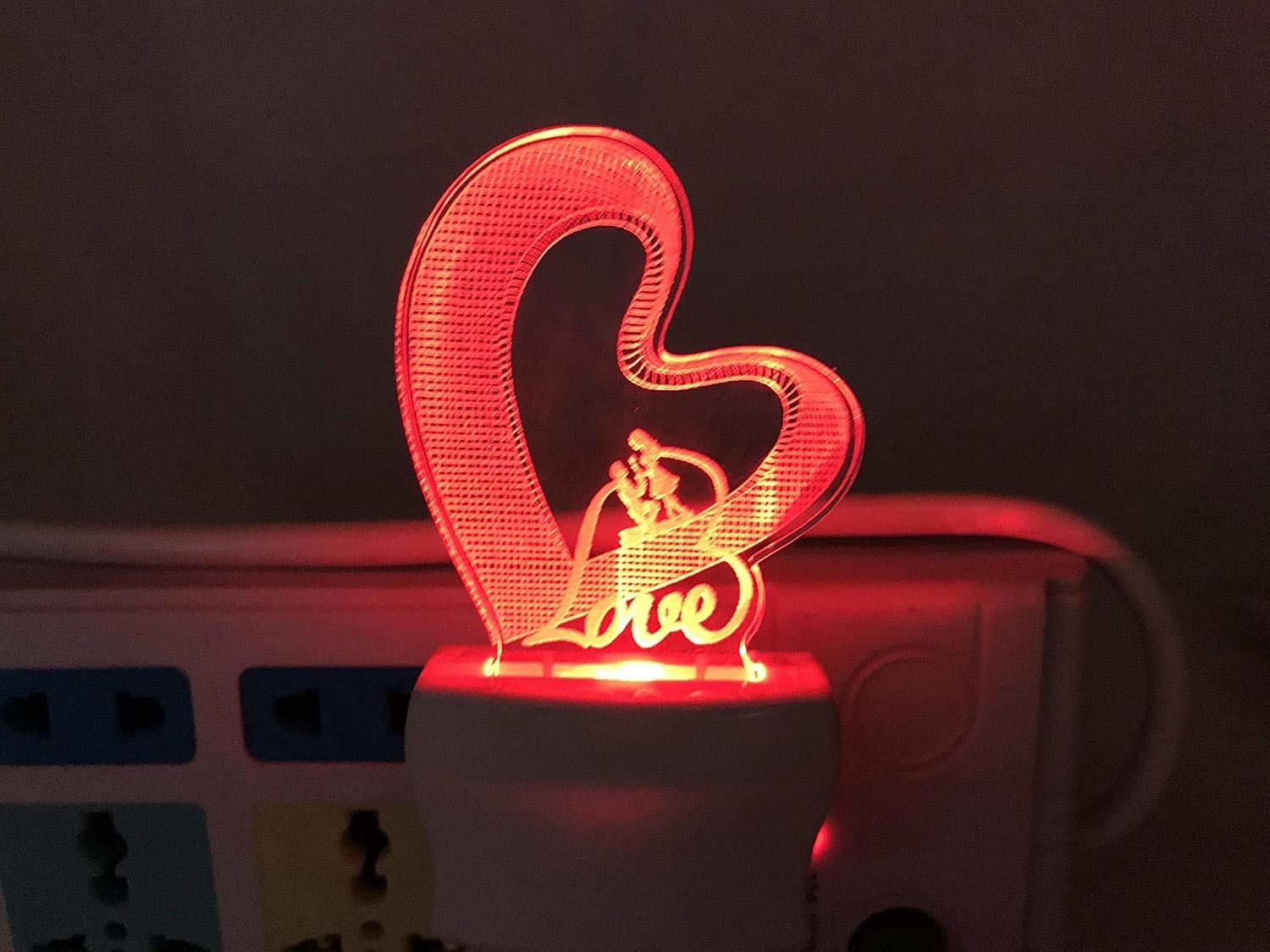 A 3D plug-in light that says Love