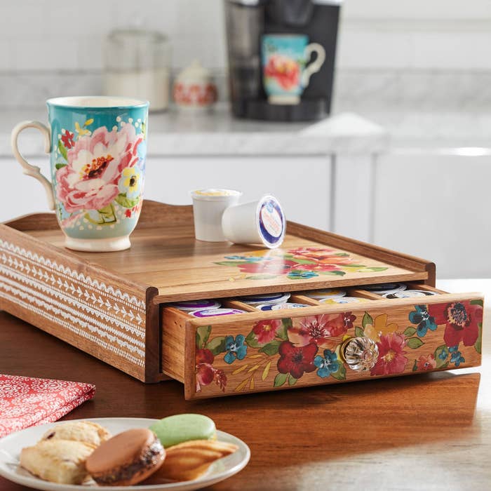 The drawer half opened, revealing creamers inside