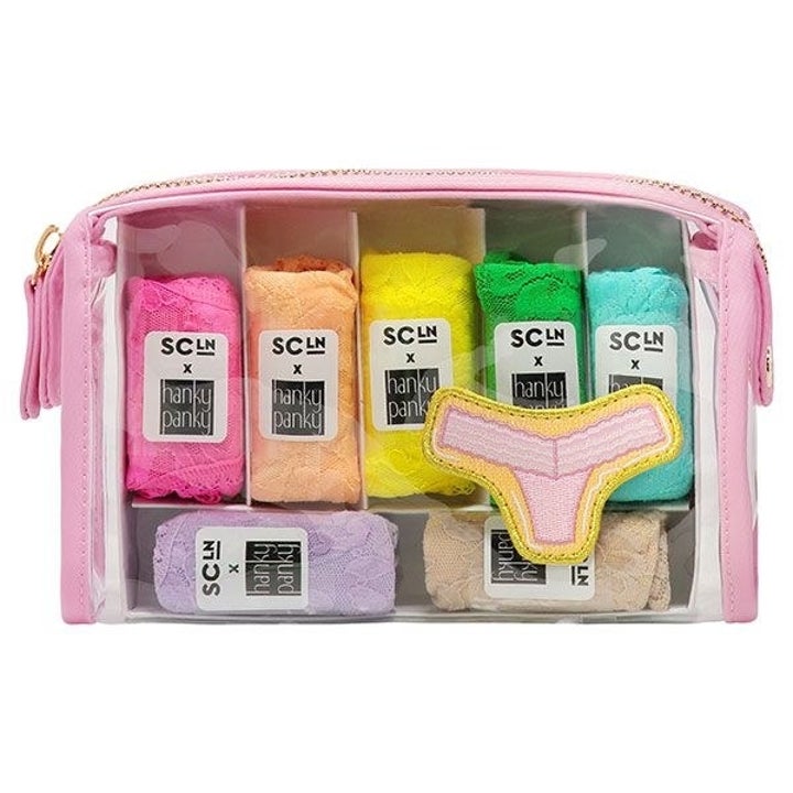 a rainbow of underwear in a clear pouch with a pink zipper in a pink thong patch on it