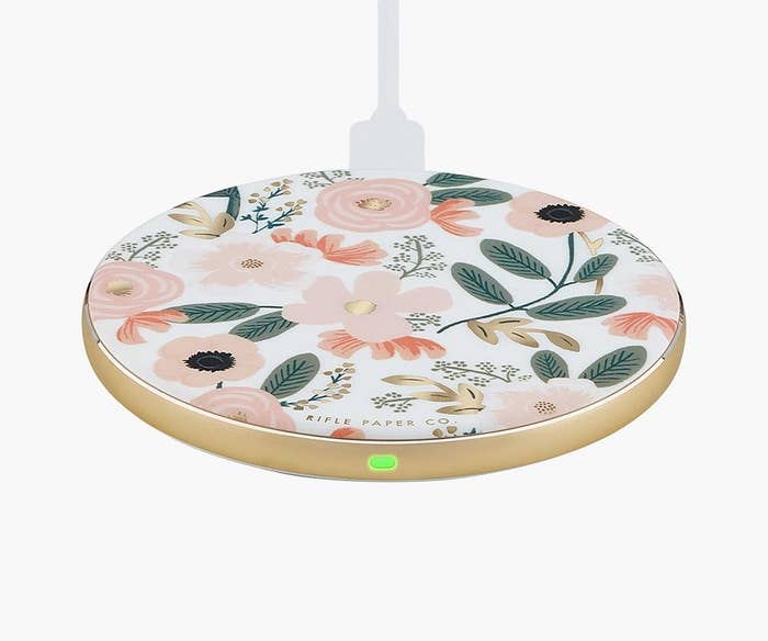 a circular charging station with a floral print on it