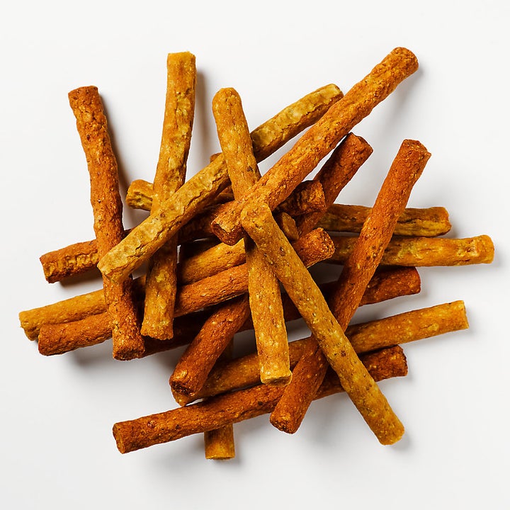 Pile of tan soft chew stick treats