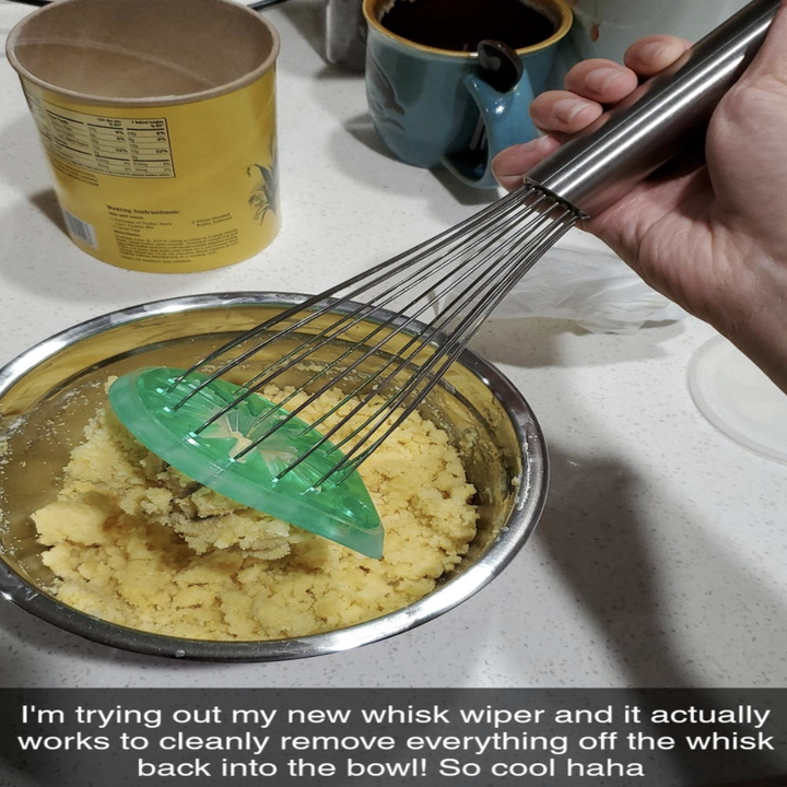 reviewer using the whisk attachment 