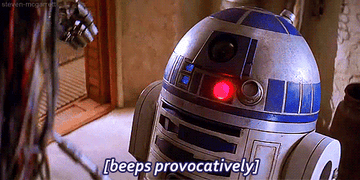 a gif of r2d2 with the caption &quot;beeps provacatively&quot;