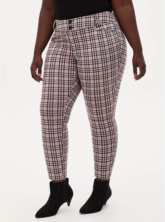 Model wearing the pink plaid skinny pants