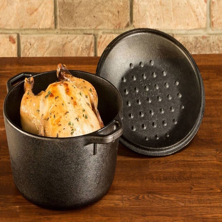 chicken in a dutch oven with the lid open