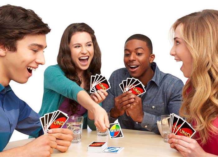 A group of models playing the card game 