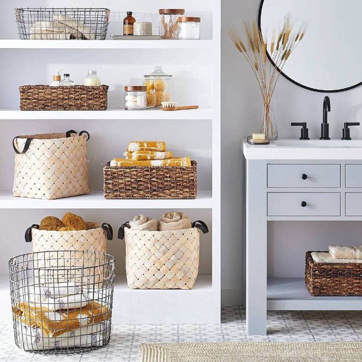 Wire storage basket with white and yellow towels inside