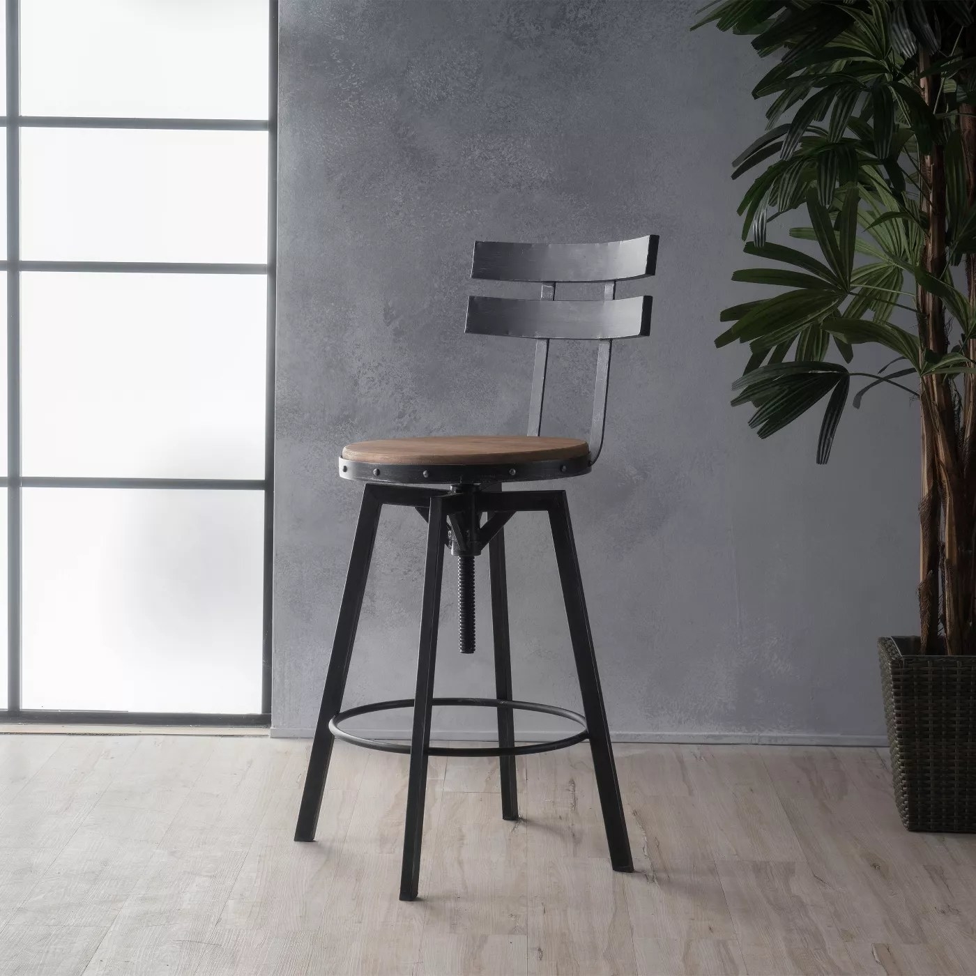 The barstool with a black frame and a wood seat