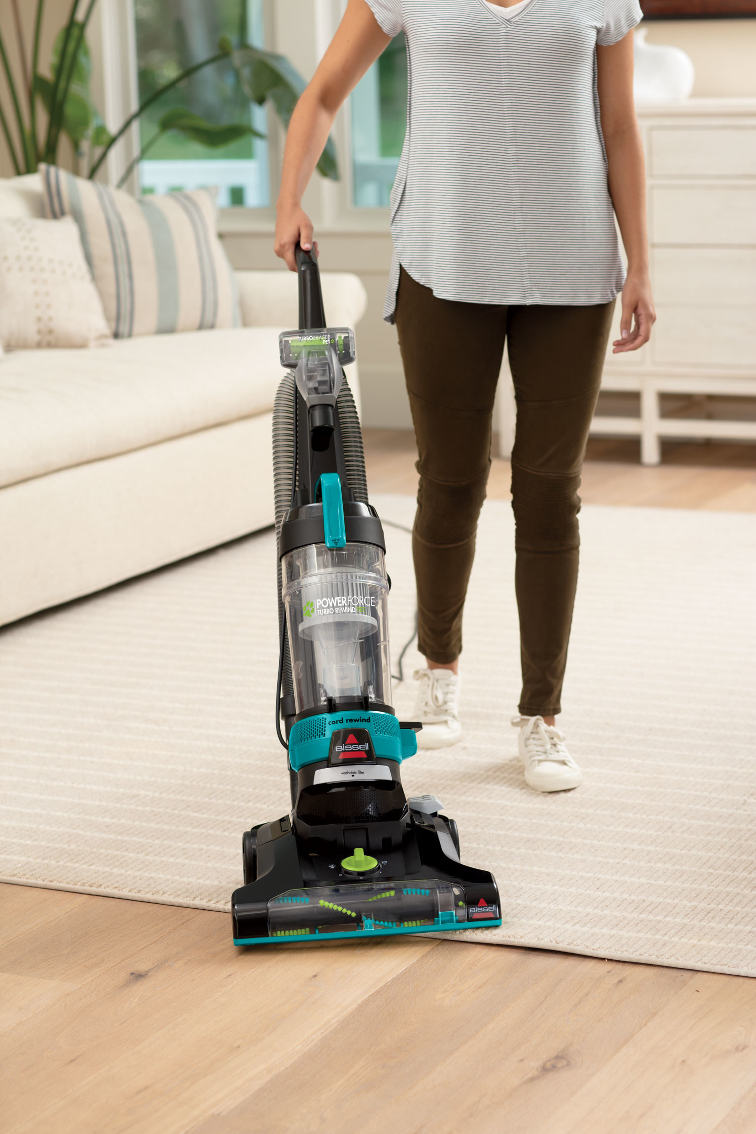 A model using the vacuum on a rug