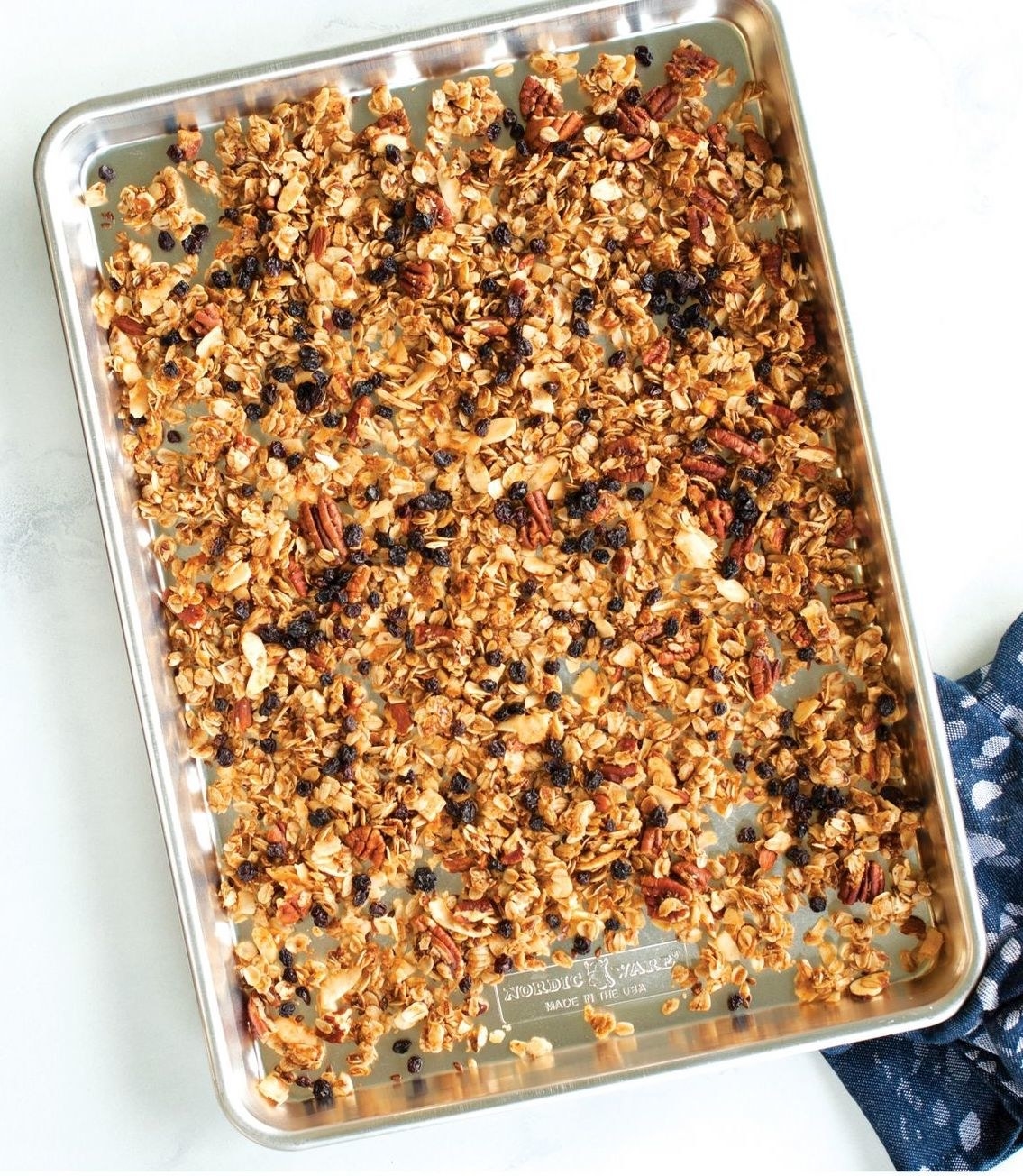 sheet pan with granola cooking on it