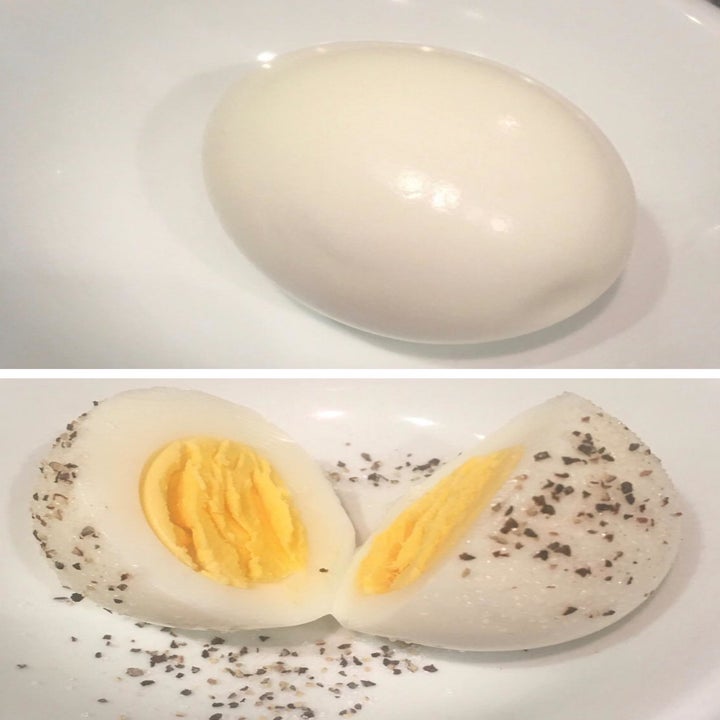 reviewer photo of hard-boiled egg they made with egg cooker 