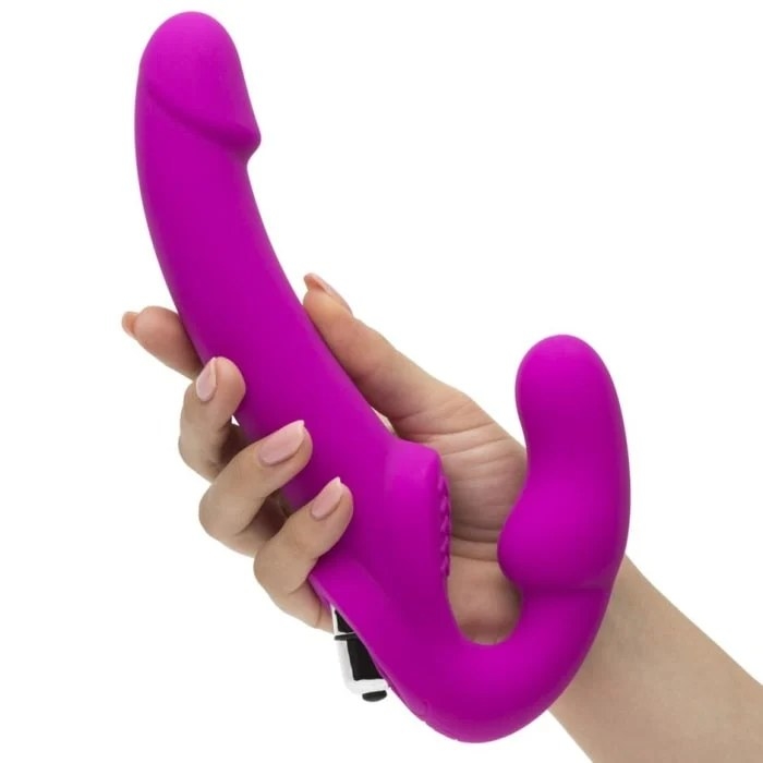 A model holding the purple strap on with its insertable, curved probe