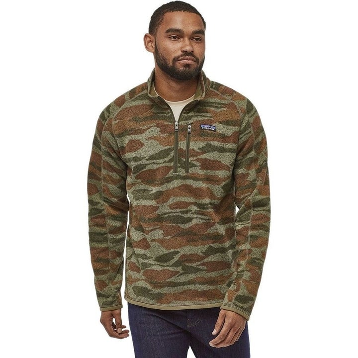 Model in camo-print long-sleeve quarter-zip pullover