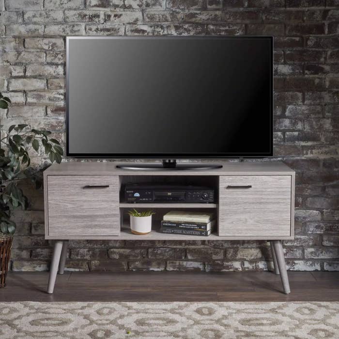 The mid-century modern media console in gray