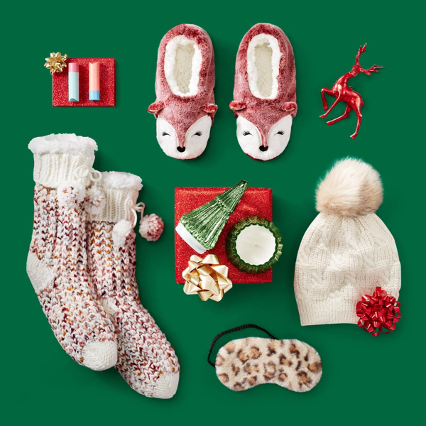 a collage of target items: socks, a beanie, face mask, slippers, and ornaments 