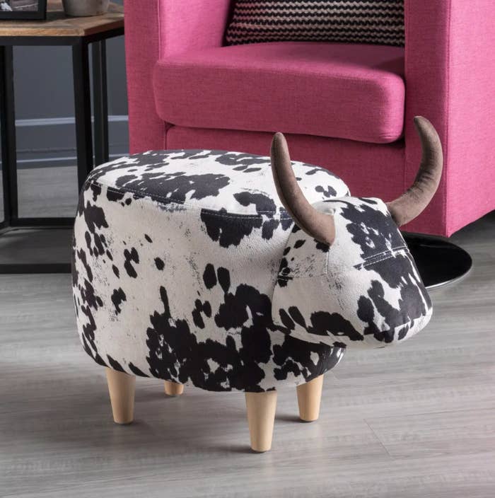 The cow ottoman in black and white