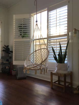 reviewer's sunroom with the hammock chair in front of a window