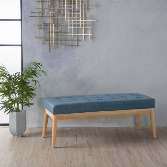The upholstered bench in blue