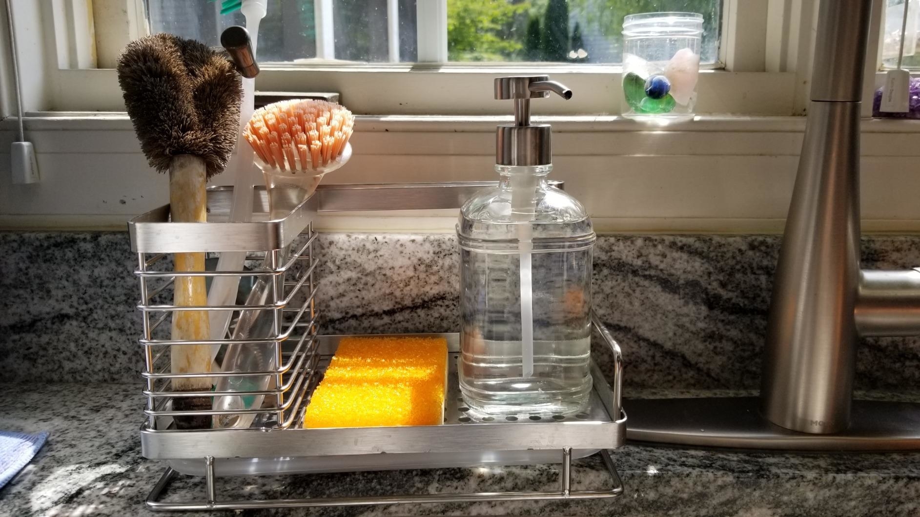 reviewer image of the odesign kitchen sink caddy organizer in a kitchen