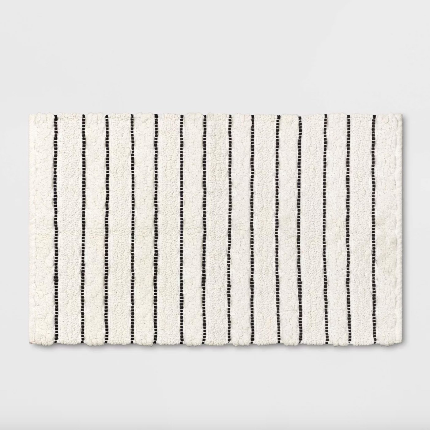 The striped bath mat in white and black