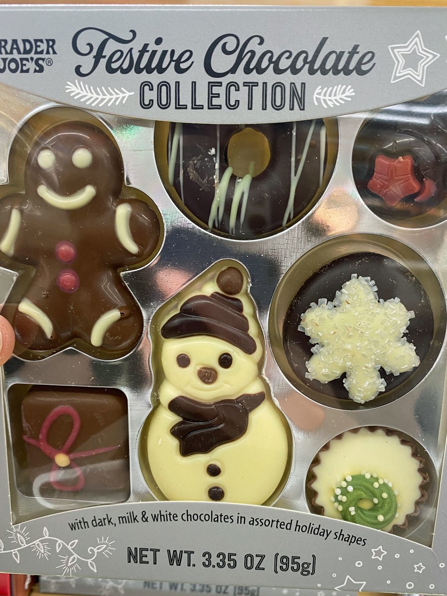 An assortment of holiday themed dark, milk, and white chocolates.