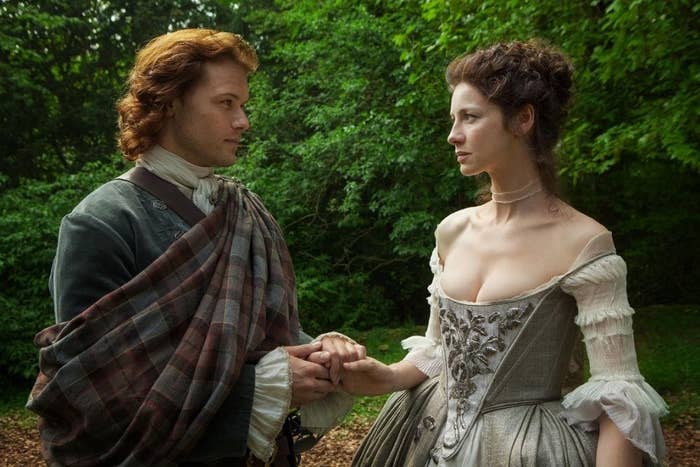 Jamie holding Claire&#x27;s hand before they walk down the aisle 