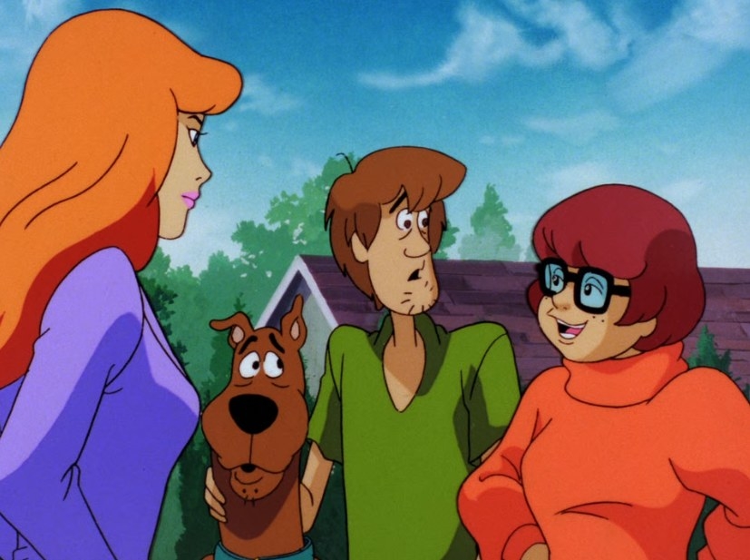 Velma and Daphne talk with Scooby Doo and Shaggy